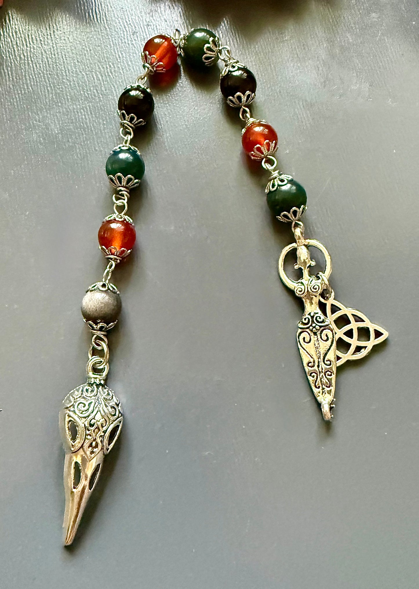 The Morrigan Devotional Prayer Beads with Crow Skull, Goddess, and Triquetra Charms.