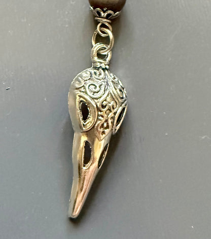 The Morrigan Devotional Prayer Beads with Crow Skull, Goddess, and Triquetra Charms.