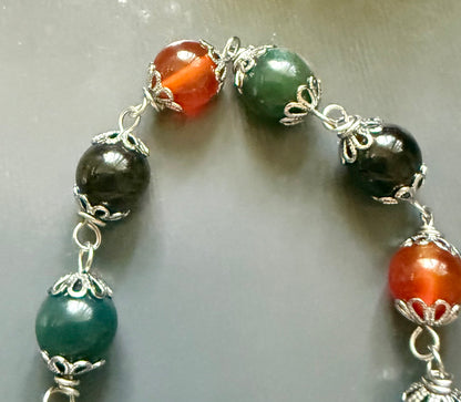 The Morrigan Devotional Prayer Beads with Crow Skull, Goddess, and Triquetra Charms.