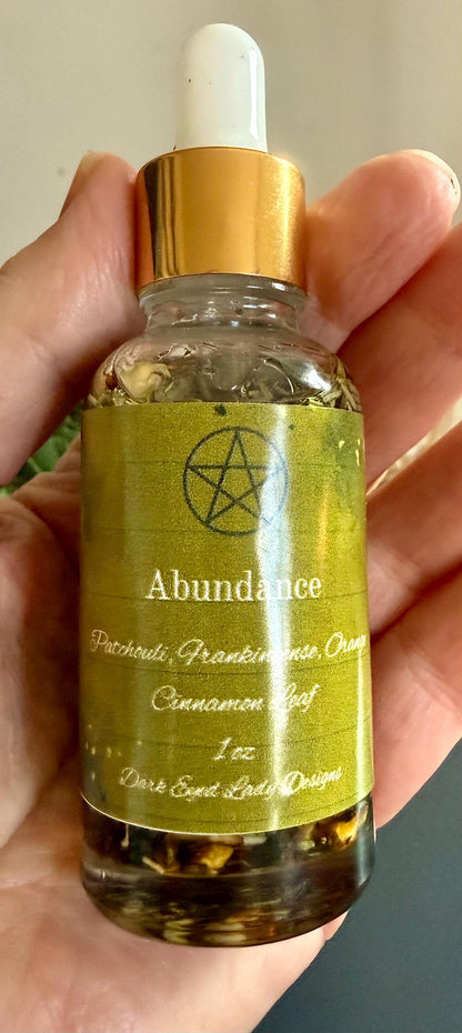 Abundance Ritual Anointing Oil with Essential Oils and Herbs.