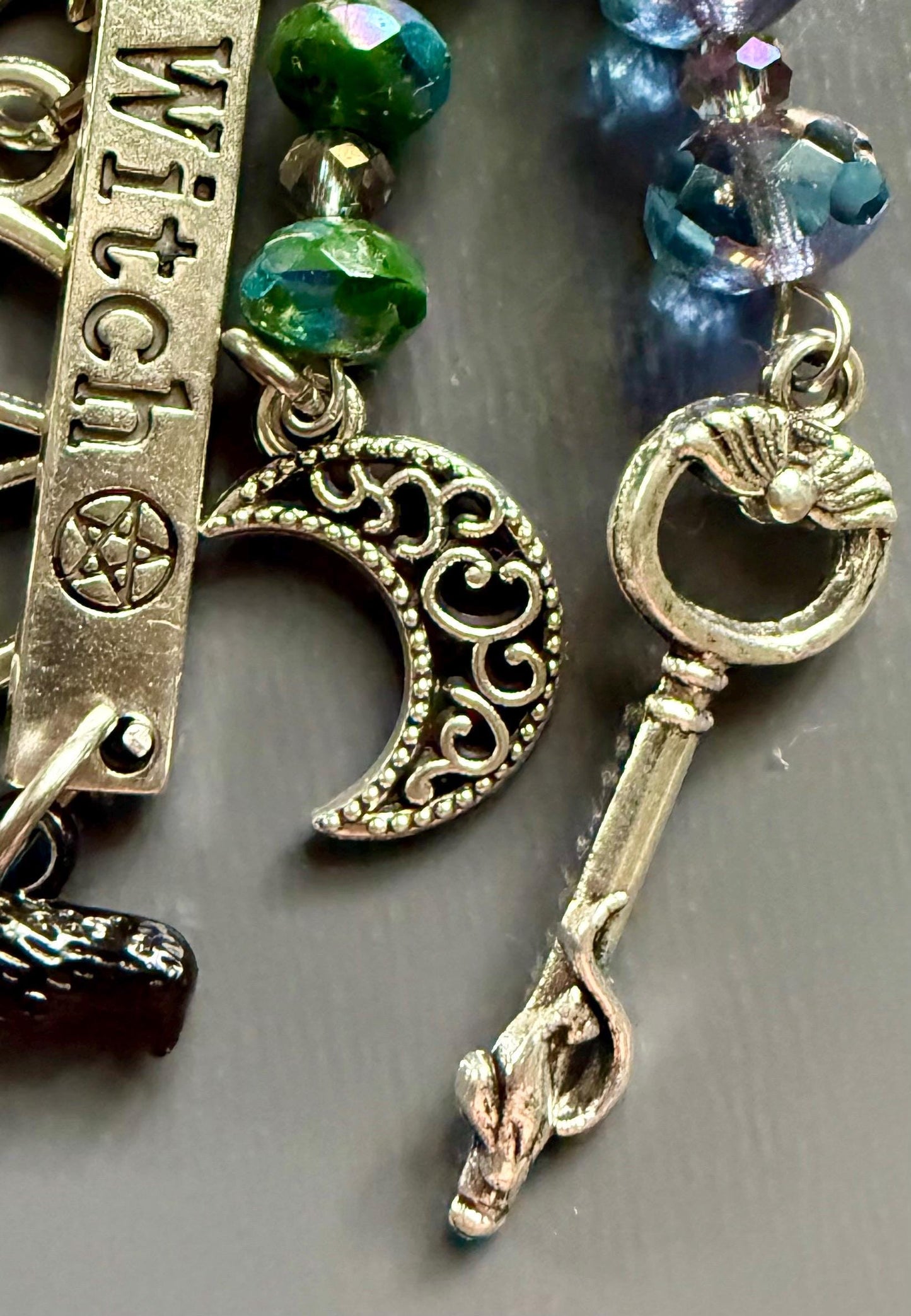 Witch Engraved Key Chain Purse Charm with Iridescent Glass Beads and Witchy Charms.