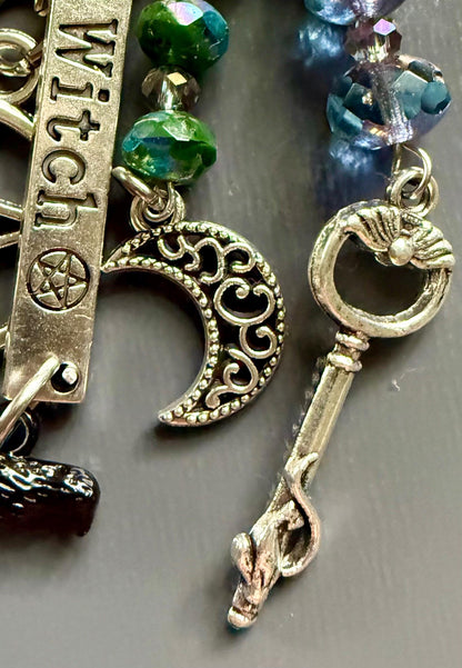 Witch Engraved Key Chain Purse Charm with Iridescent Glass Beads and Witchy Charms.