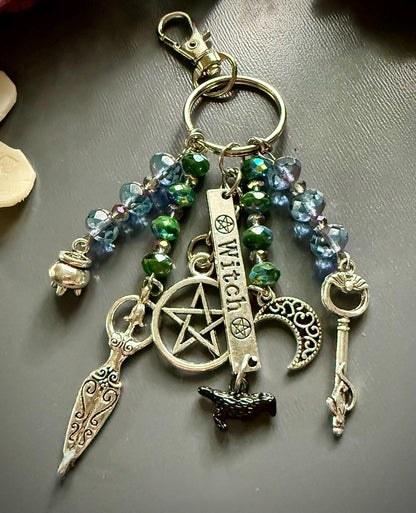 Witch Engraved Key Chain Purse Charm with Iridescent Glass Beads and Witchy Charms.