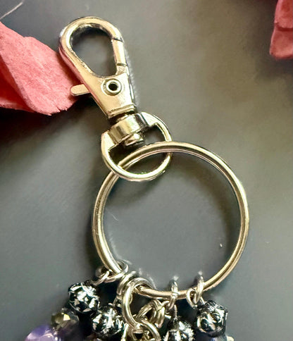 Witch Engraved Keychain Bag Charm with Iridescent Purple Beads and Witchy Charms.
