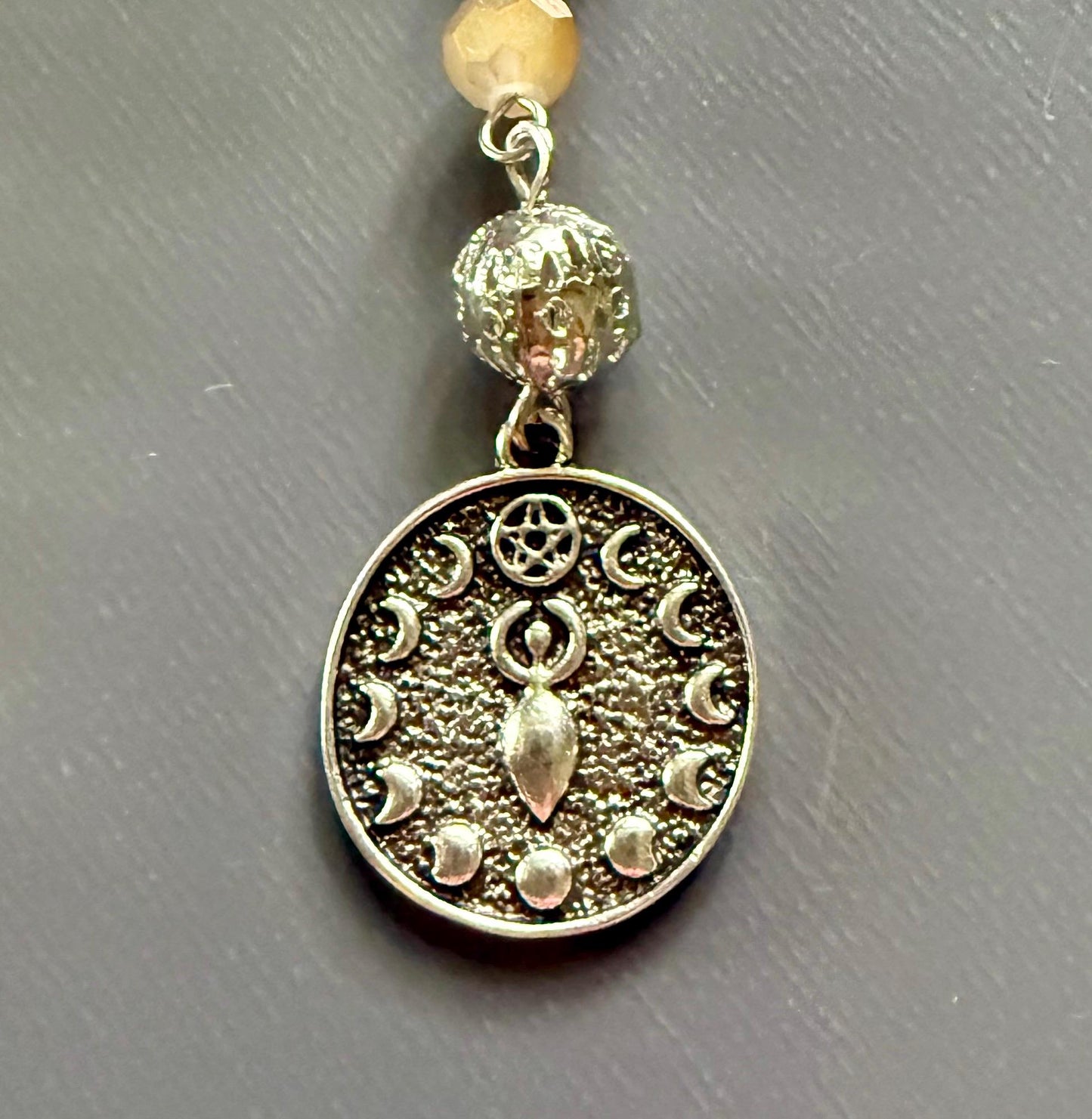 Serpentine Dowsing Pendulum with Iridescent Glass Beads and Moon Goddess Charm.