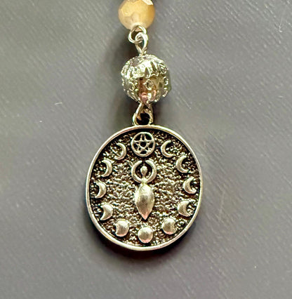 Serpentine Dowsing Pendulum with Iridescent Glass Beads and Moon Goddess Charm.