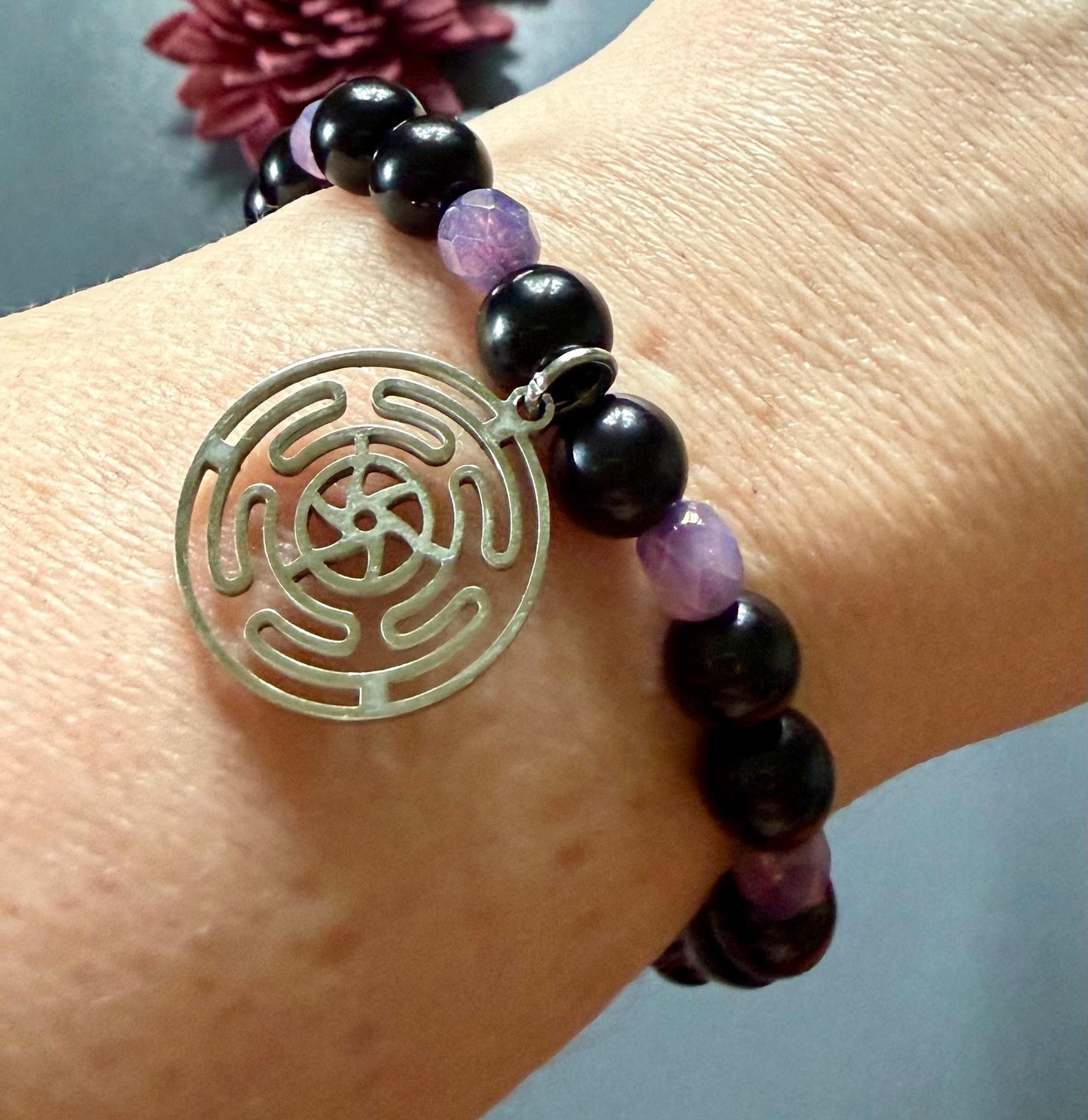 Hekate’s Wheel Devotional Bracelet with Obsidian and Iridescent Purple Glass Beads.