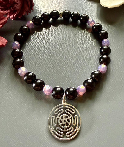 Hekate’s Wheel Devotional Bracelet with Obsidian and Iridescent Purple Glass Beads.