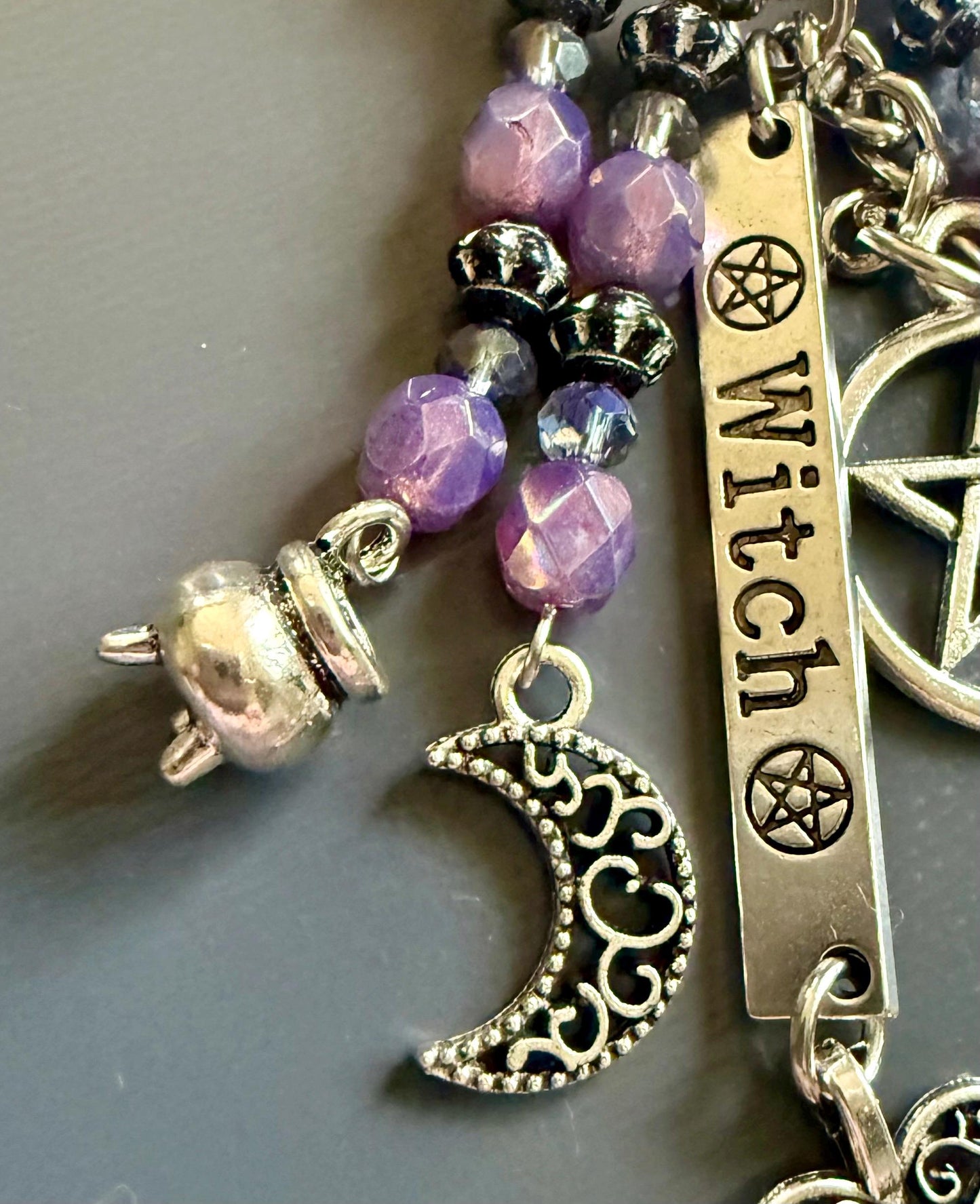 Witch Engraved Keychain Bag Charm with Iridescent Purple Beads and Witchy Charms.