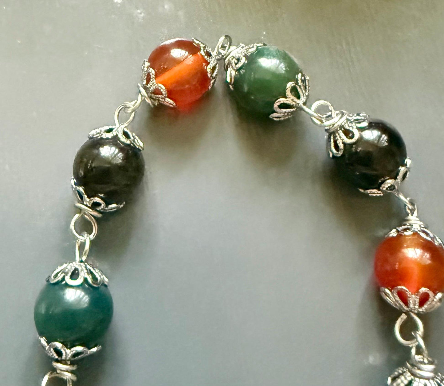 Morrigan Celtic Goddess Prayer Beads: Carnelian, Moss Agate, Obsidian, Crow Skull, and Triquetra Charm.
