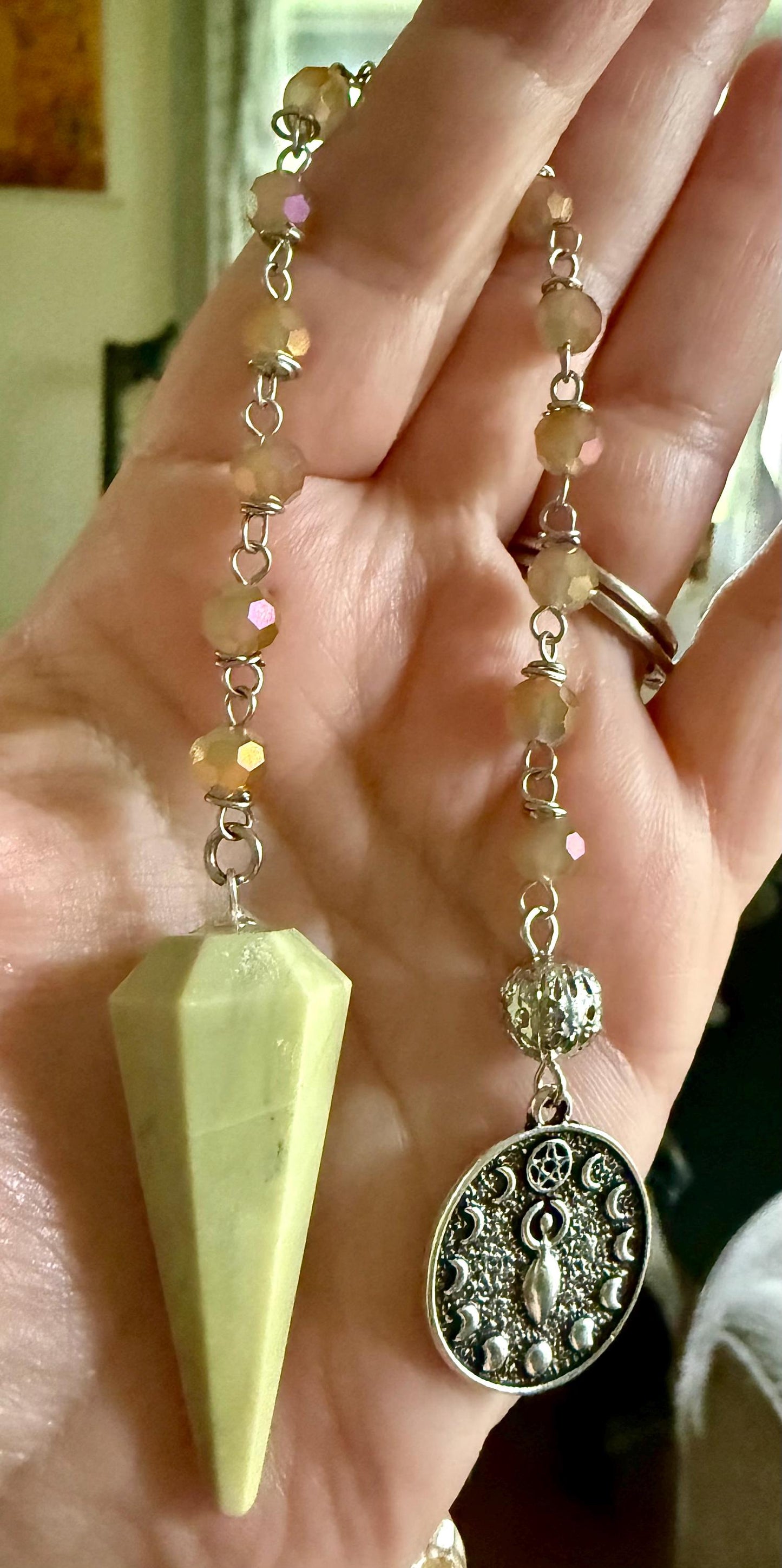 Serpentine Dowsing Pendulum with Iridescent Glass Beads and Moon Goddess Charm.