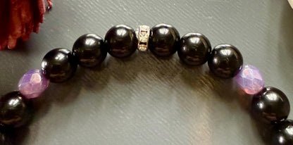 Hekate’s Wheel Devotional Bracelet with Obsidian and Iridescent Purple Glass Beads.