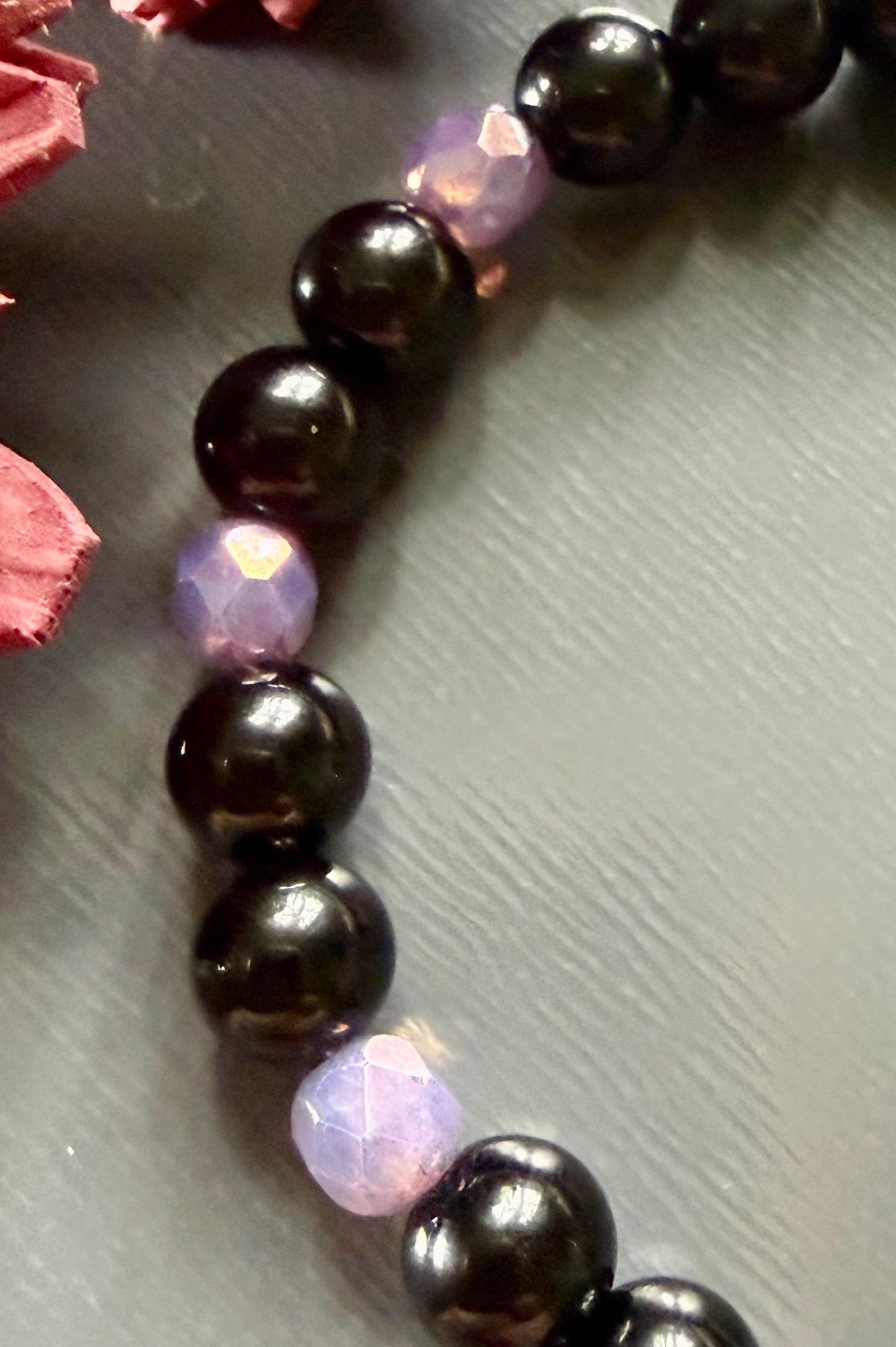 Hekate’s Wheel Devotional Bracelet with Obsidian and Iridescent Purple Glass Beads.