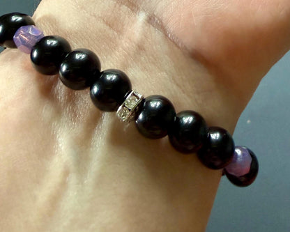 Hekate’s Wheel Devotional Bracelet with Obsidian and Iridescent Purple Glass Beads.