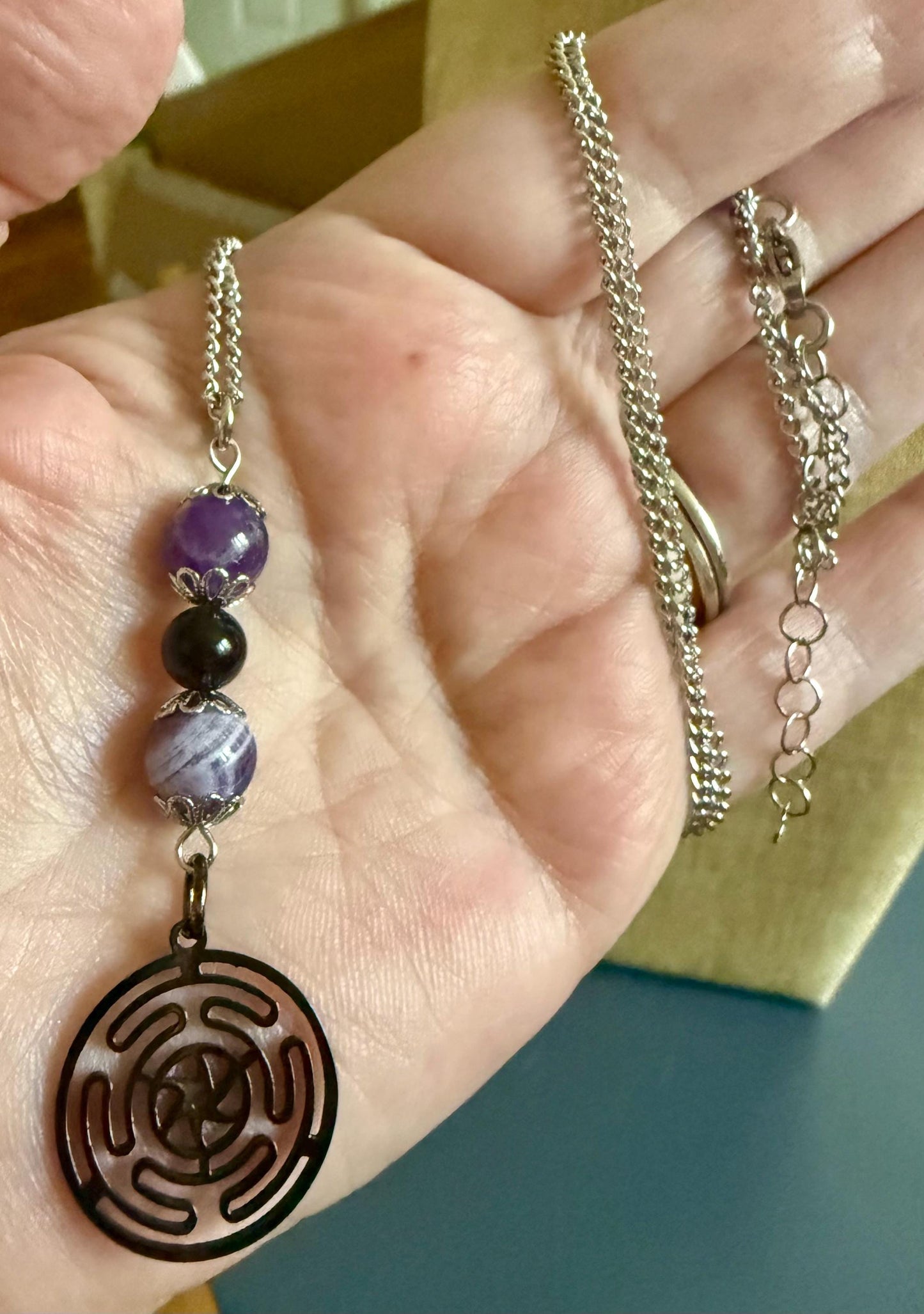 Hekate’s Wheel Strophalos Charm Necklace with Obsidian and Amethyst Beads.
