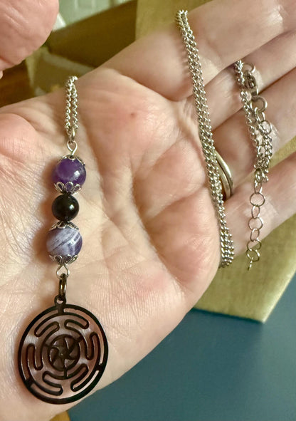 Hekate’s Wheel Strophalos Charm Necklace with Obsidian and Amethyst Beads.