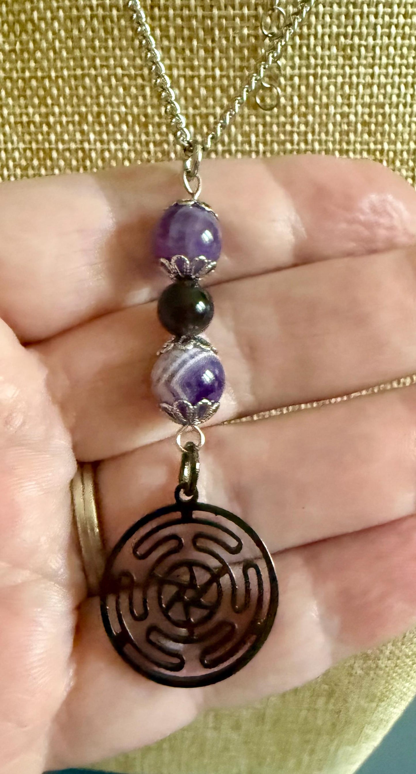 Hekate’s Wheel Strophalos Charm Necklace with Obsidian and Amethyst Beads.