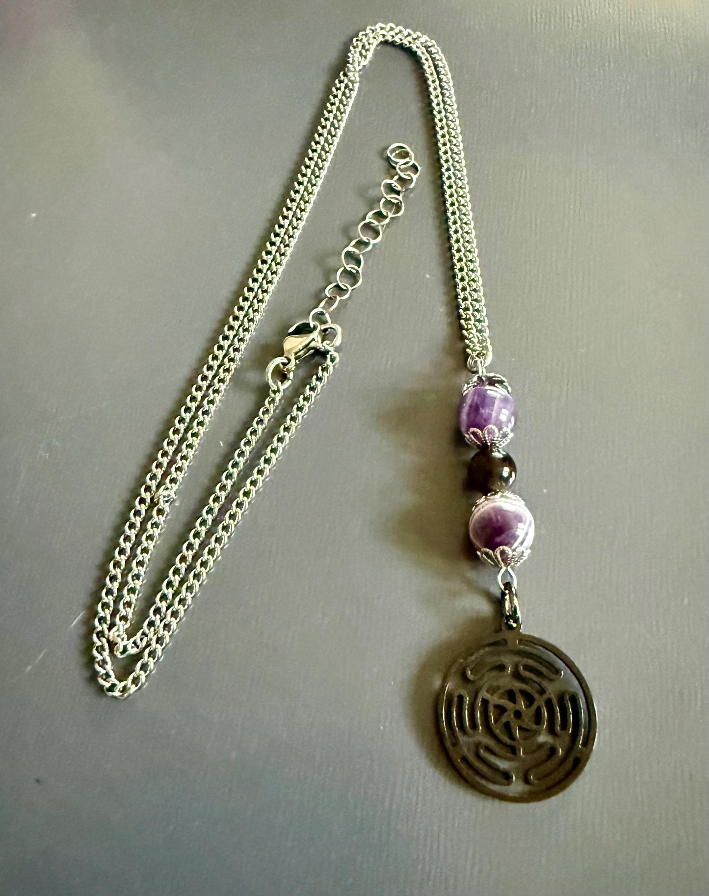 Hekate’s Wheel Strophalos Charm Necklace with Obsidian and Amethyst Beads.