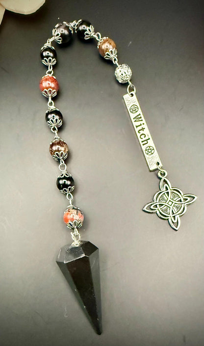 Tourmaline Point Pendulum with Red Brecciated Jasper, Obsidian, and Witch’s Knot Charm.