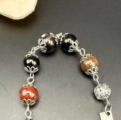 Tourmaline Point Pendulum with Red Brecciated Jasper, Obsidian, and Witch’s Knot Charm.