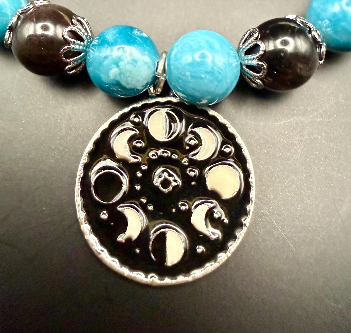 Blue Quartz and Obsidian Beaded Stretch Bracelet with Moon Phases Charm.
