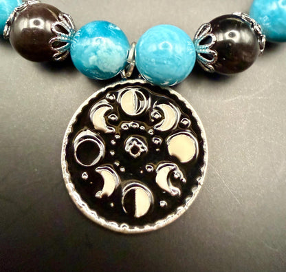 Blue Quartz and Obsidian Beaded Stretch Bracelet with Moon Phases Charm.