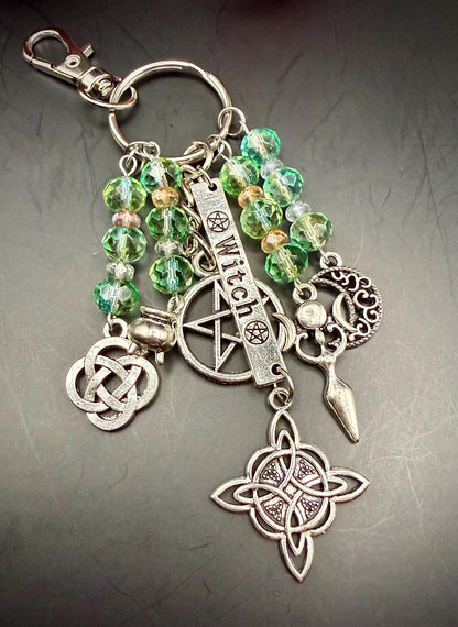 Witch Engraved Key Chain Bag Charm with Iridescent Glass Beads and Witchy Charms.