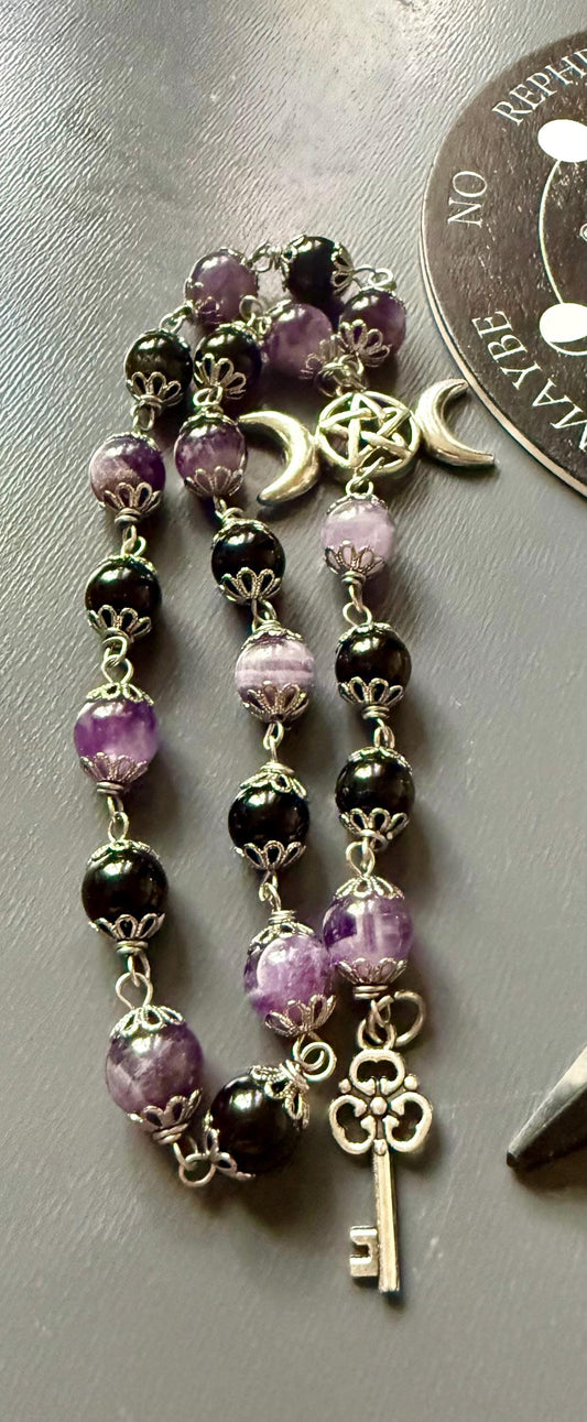 Goddess Hekate Devotional Altar Bundle with Witch’s Rosary, Pendulum , and Black Beeswax Pillar Candle.