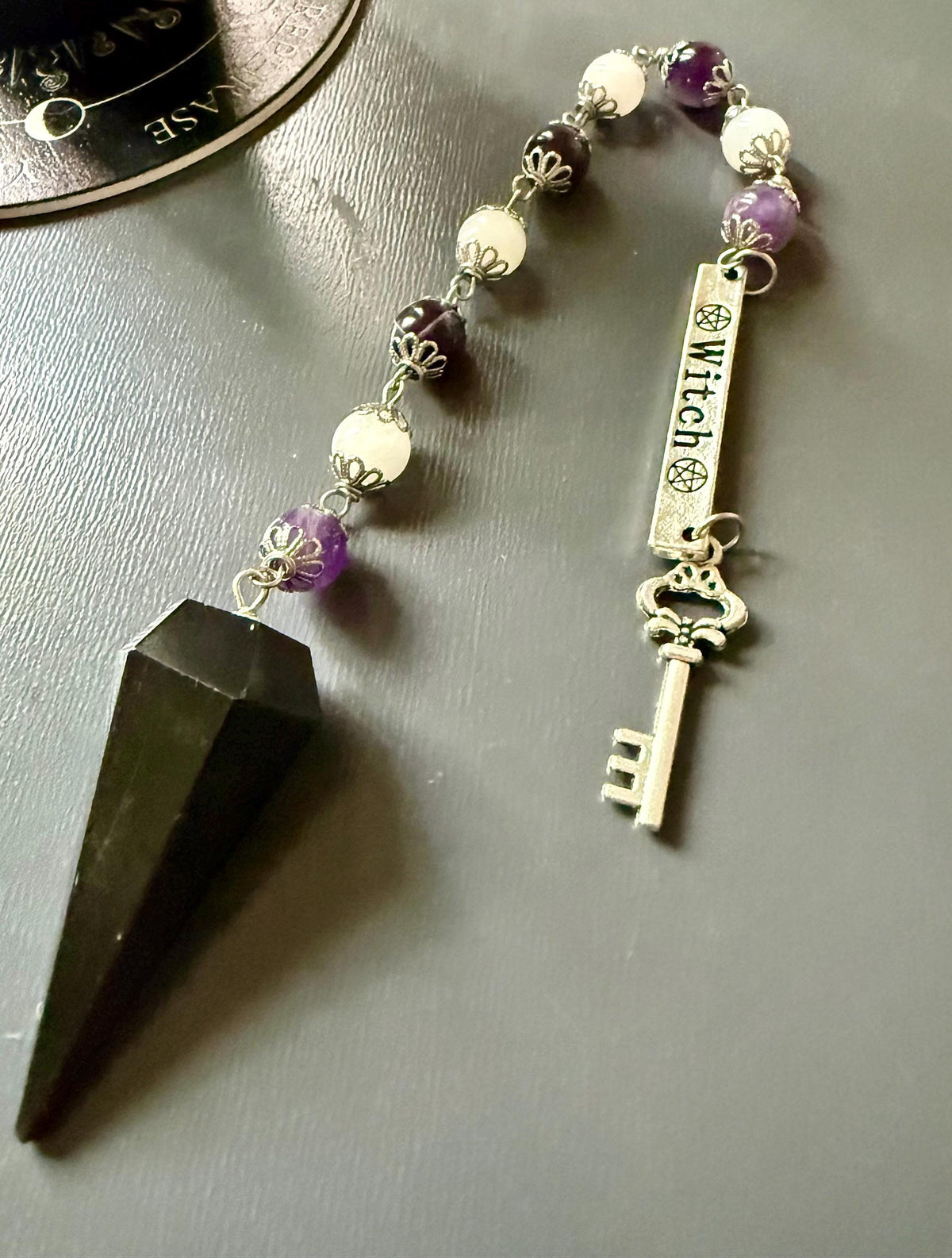Goddess Hekate Devotional Altar Bundle with Witch’s Rosary, Pendulum , and Black Beeswax Pillar Candle.