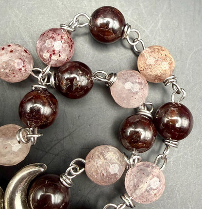 Witch’s Rosary: Strawberry Quartz, Garnet, Triple Moon, and Witch’s Knot Charm.