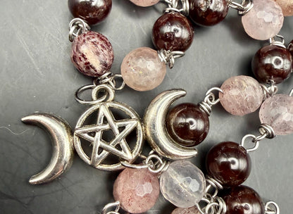 Witch’s Rosary: Strawberry Quartz, Garnet, Triple Moon, and Witch’s Knot Charm.