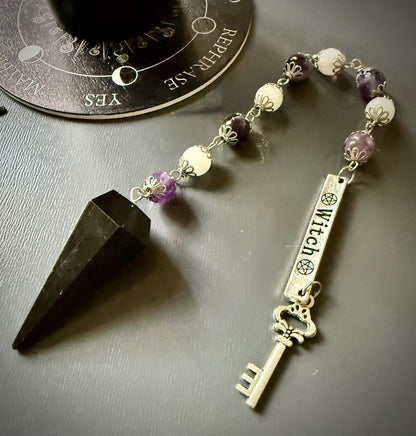 Goddess Hekate Devotional Altar Bundle with Witch’s Rosary, Pendulum , and Black Beeswax Pillar Candle.