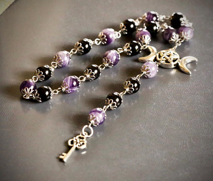 Goddess Hekate Devotional Altar Bundle with Witch’s Rosary, Pendulum , and Black Beeswax Pillar Candle.