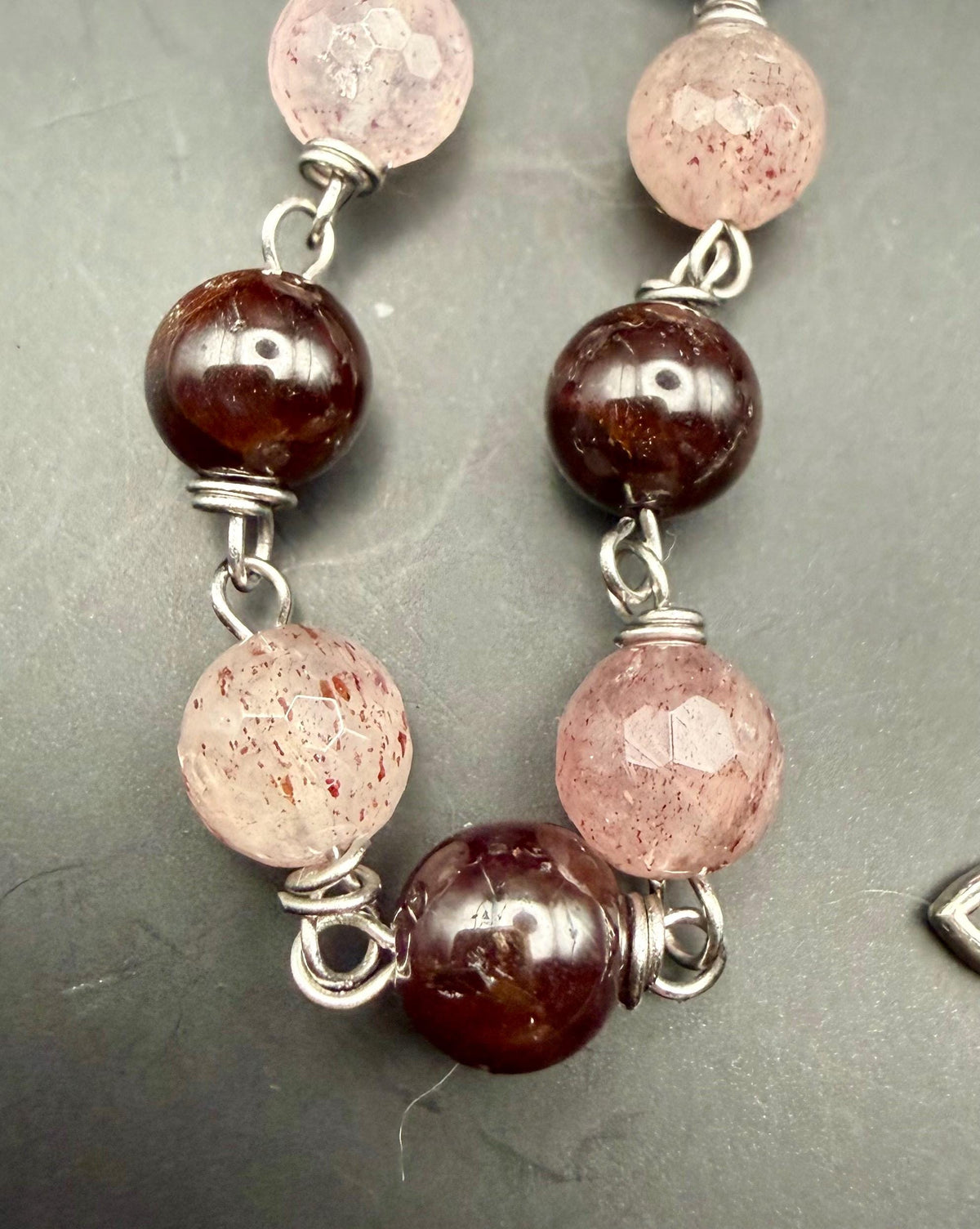 Witch’s Rosary: Strawberry Quartz, Garnet, Triple Moon, and Witch’s Knot Charm.