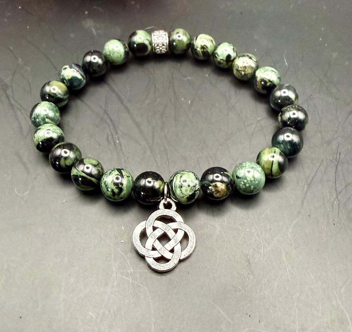 Kambaba Jasper Gemstone Stretch Bracelet with Celtic Knot Charm.