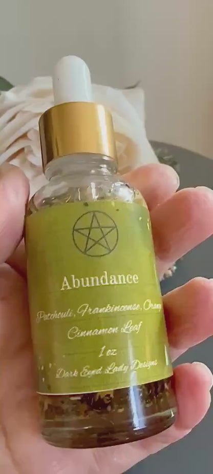 Abundance Ritual Anointing Oil with Essential Oils and Herbs.