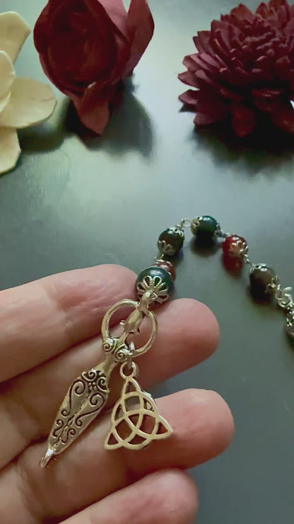 The Morrigan Devotional Prayer Beads with Crow Skull, Goddess, and Triquetra Charms.